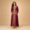Front view of a deep magenta Moroccan caftan with gold floral detailing and a coordinating waist belt