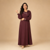 Front view of a burgundy Moroccan djellaba with asymmetric detailing, curved chest motifs and gathered sleeves