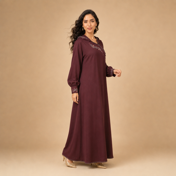 Back view of a burgundy Moroccan djellaba with a pointed hood, gathered sleeves and decorated cuffs