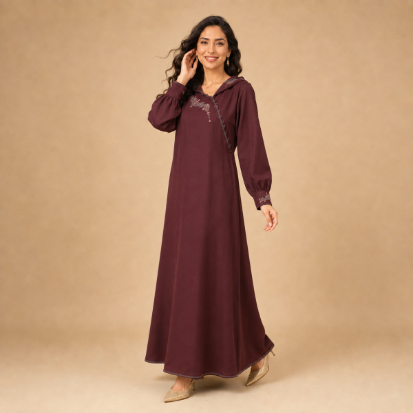 Back view of a burgundy Moroccan djellaba with a pointed hood, gathered sleeves and decorated cuffs