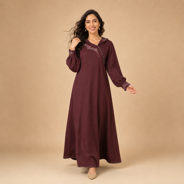 Back view of a burgundy Moroccan djellaba with a pointed hood, gathered sleeves and decorated cuffs