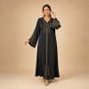 Front view of a black Moroccan djellaba with copper and teal geometric details and flared patterned sleeves
