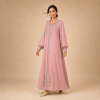 Back view of a dusty pink Moroccan djellaba with a pointed hood, grey edging and decorated cuffs