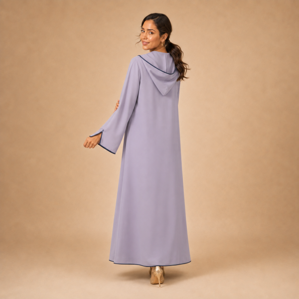Back view of a lavender Moroccan djellaba with a pointed hood, navy edging and split sleeve ends