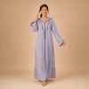 Back view of a lavender Moroccan djellaba with a pointed hood, navy edging and split sleeve ends