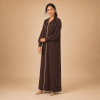 Back view of a chocolate-brown Moroccan djellaba with a pointed hood, beige edging and decorated fitted cuffs
