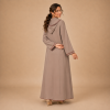 Back view of a warm taupe Moroccan djellaba with a pointed hood, burgundy edging and embroidered sleeve openings