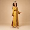 Back view of a golden mustard Moroccan caftan with wide decorated cuffs and burgundy side panels