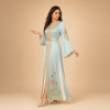 Back view of a powder blue Moroccan caftan with floral details, decorated sleeves and a matching belt