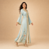 Back view of a powder blue Moroccan caftan with floral details, decorated sleeves and a matching belt