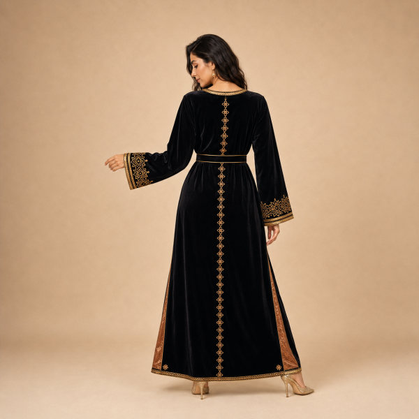 28 Back view of a black Moroccan caftan with gold geometric details, wide cuffs and bronze side panels
