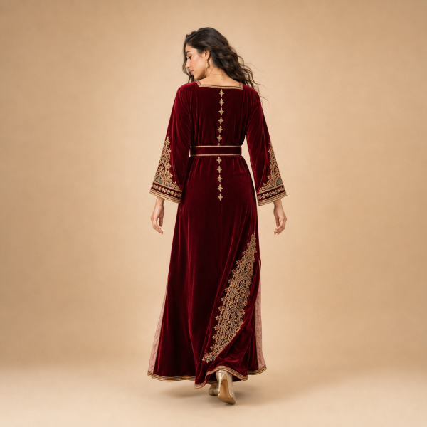 Back view of a burgundy Moroccan caftan with decorated sleeves, gold motifs and contrasting side panels