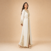 36 Back view of an ivory Moroccan caftan with gold sleeve details and an ornamental lower-side design