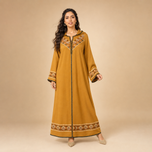 Front view of a mustard yellow Moroccan djellaba with geometric chest detailing, patterned cuffs and a decorative hem band