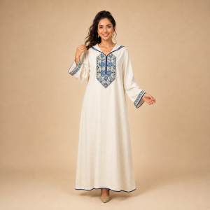 Front view of an ivory Moroccan djellaba with a blue and turquoise mosaic chest panel and patterned cuffs