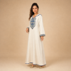 87 Back view of an ivory Moroccan djellaba with blue edging, patterned cuffs and a pointed hood with a small geometric accent